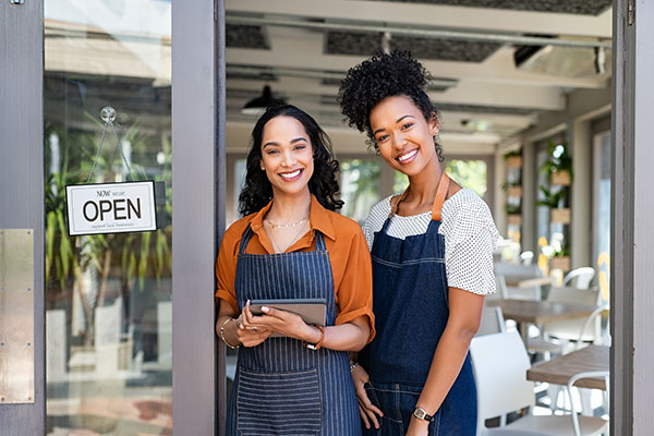 women opening cafe for the day